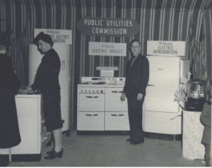 Historical photograph of a display of kitchen appliances at the Manitowoc power plant.