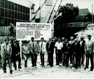 Historical photograph commemorating the finalized expansion of the Manitowoc power plant.