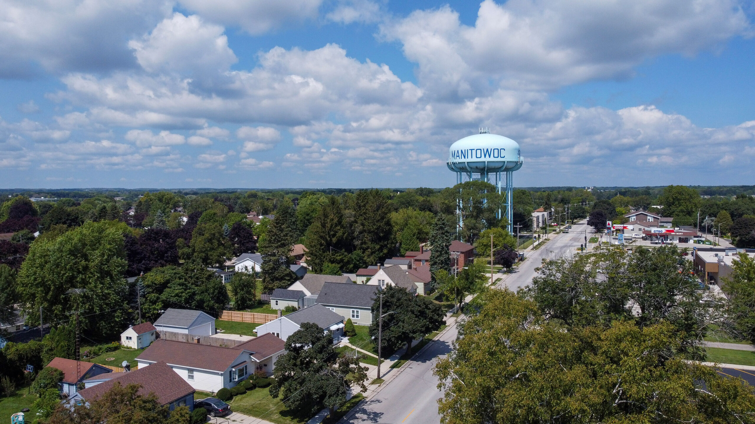 Landscape view of the Manitowoc water tower and the residential street that runs by it
